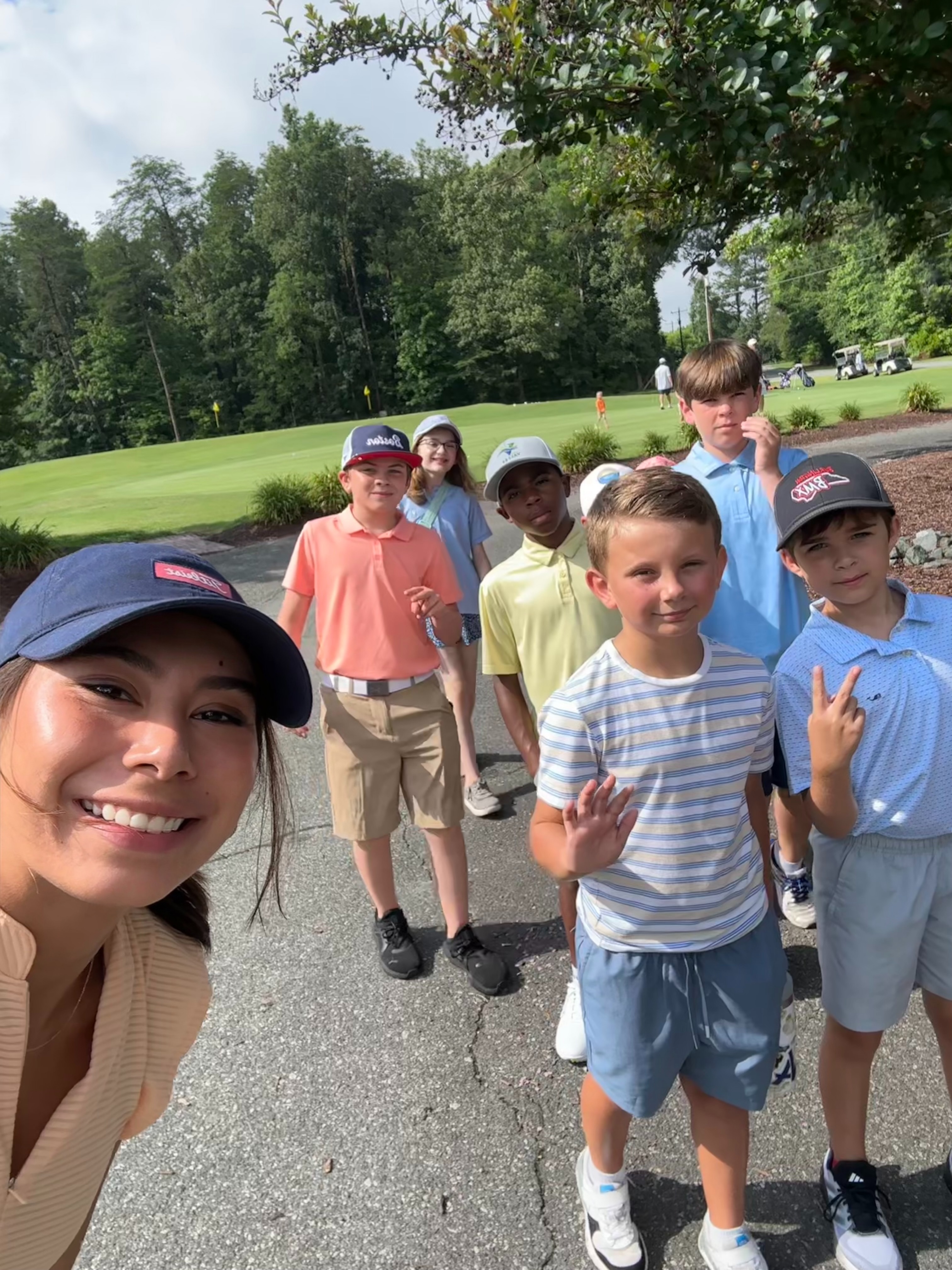 Valeria with a group of her junior golf students at the course